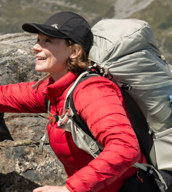 Person wearing red macpac uber jacket